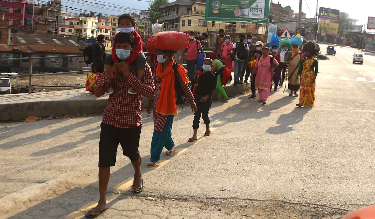 Nepal's daily wage workers walk home to remote districts.