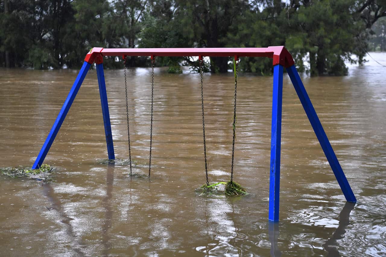 A semi-submerged child’s playground on the banks of the flooded Nepean River at Trench Reserve at Penrith in Sydney, Monday, March 22, 2021.