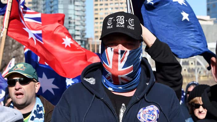 Right wing protesters from the UPF and the True Blue Crew march to Carlton Gardens as Anti racism and Fascism gathered at Parliament House in Melbourne, Sunday, June 26, 2016. (AAP Image/Tracey Nearmy) NO ARCHIVING