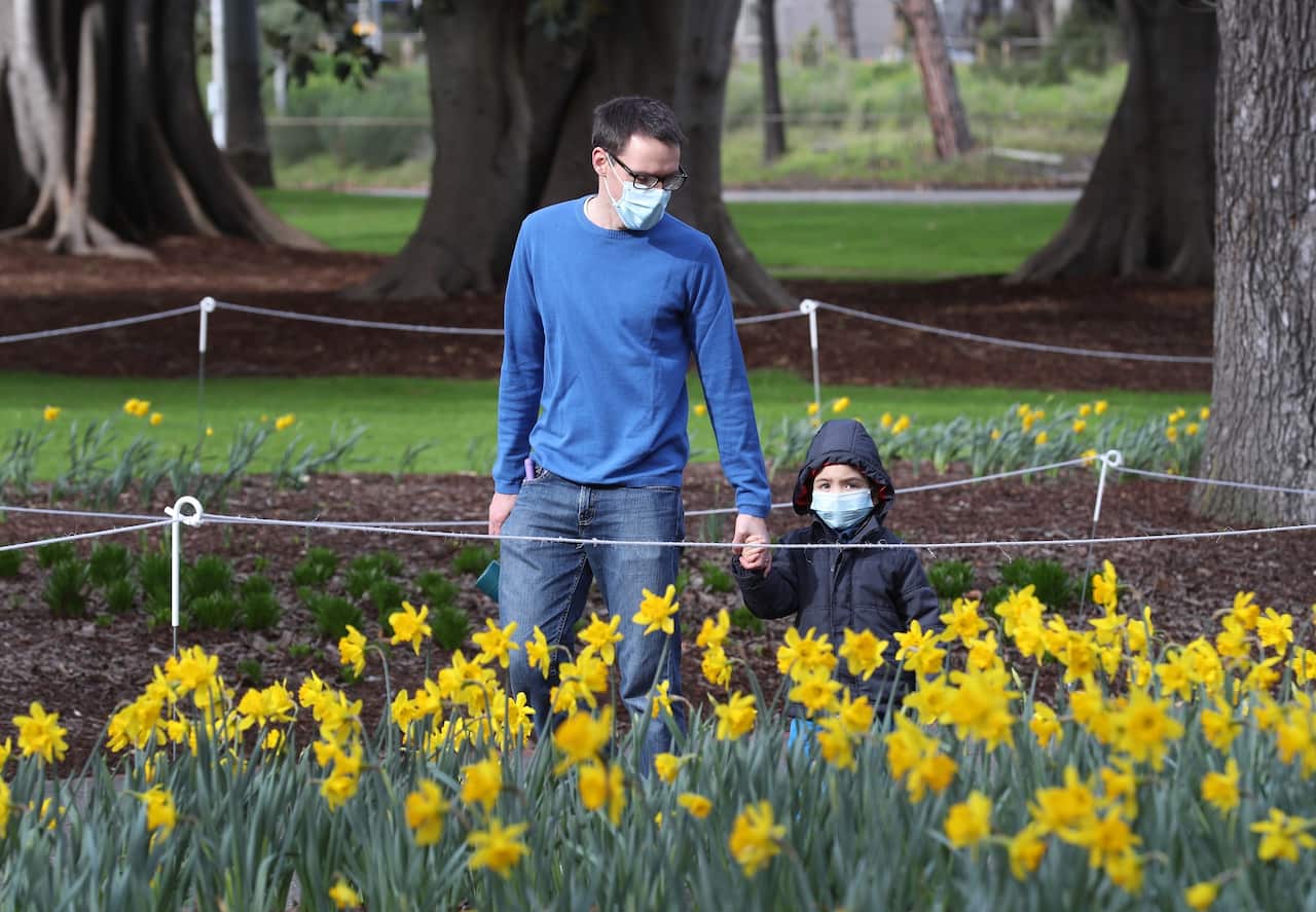 People are seen at Fitzroy Gardens in East Melbourne, Saturday, July 18, 2020. Victoria has recorded 217 new COVID-19 cases today bringing the state's number of active cases to 2608. (AAP Image/David Crosling) NO ARCHIVING