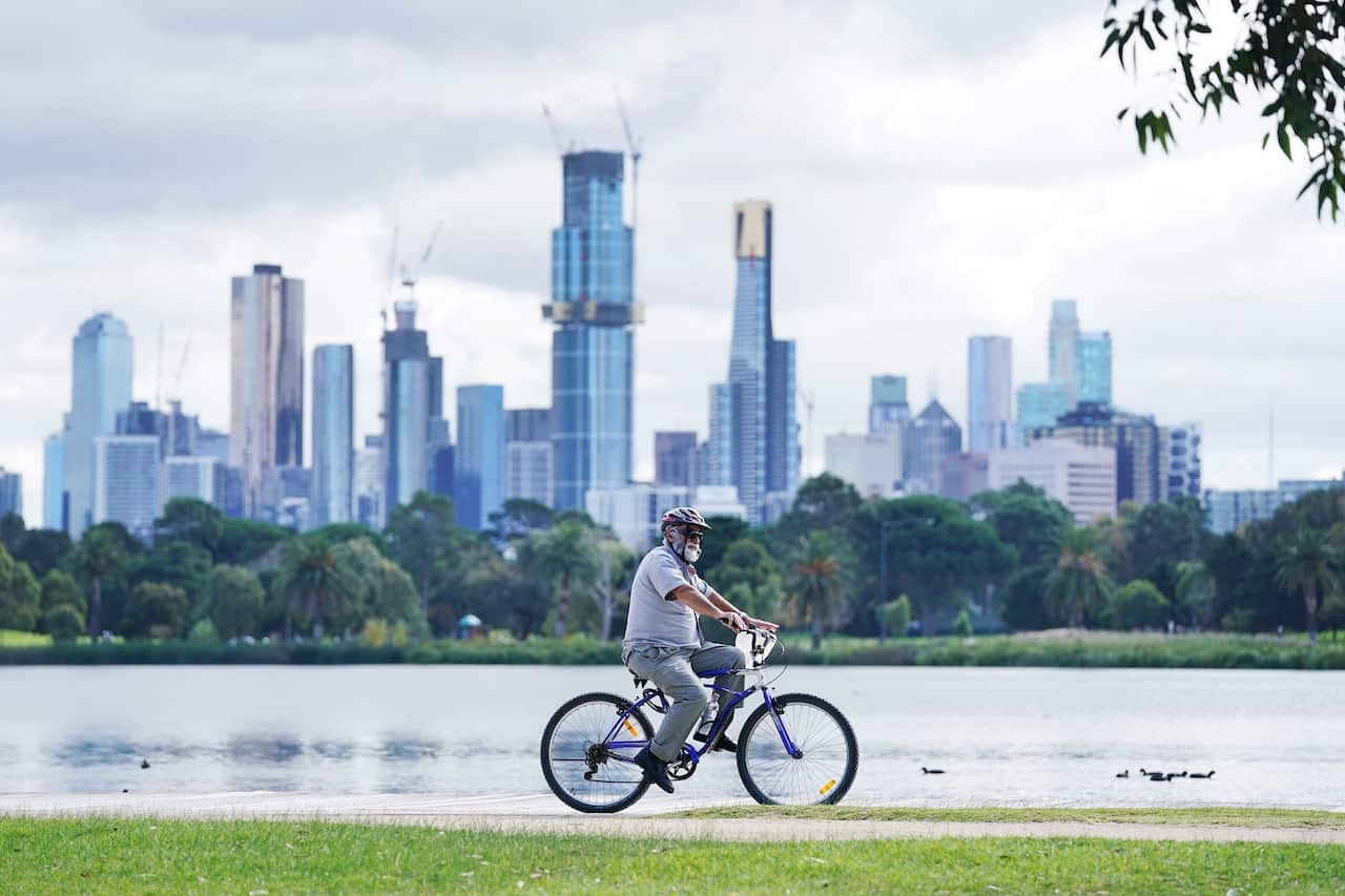 People exercise at Albert Park Lake in Melbourne