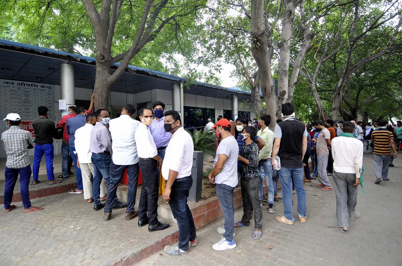 People queueing for a COVID-19 test in Noida, India