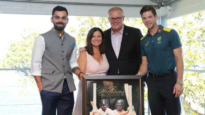 PM Morrison is with Indian and Australian captains