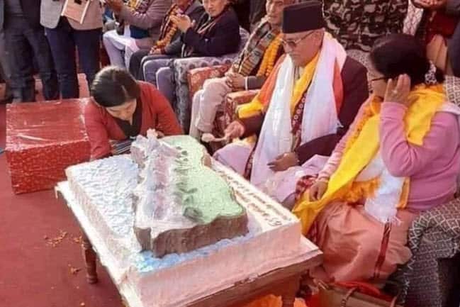 PM KP Sharma Oli cutting cake for his birthday celebrations.