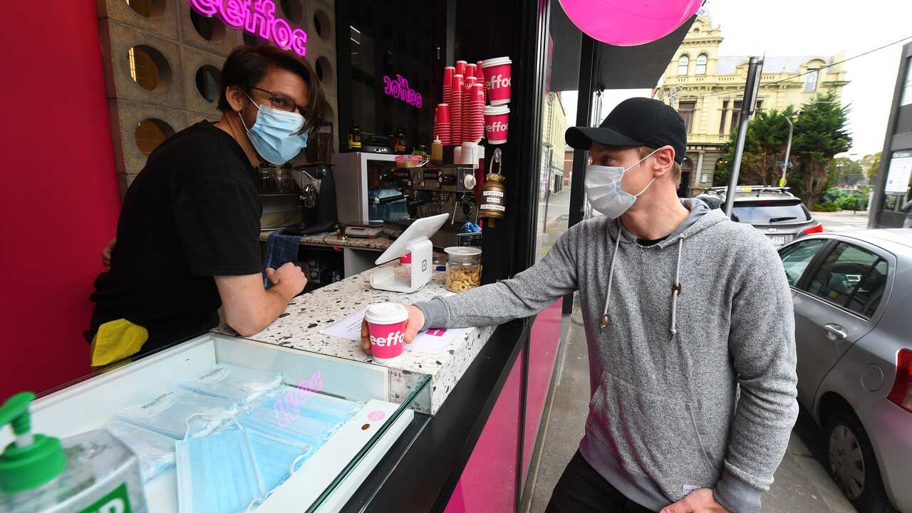 Melbournians going back to normal life, having a coffee