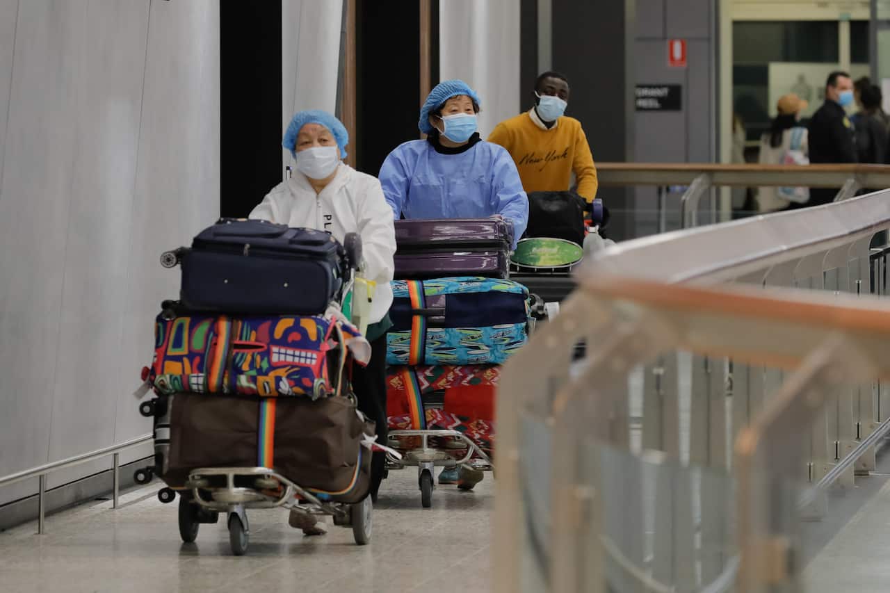 Passengers are seen arriving at Melbourne International Airport in Melbourne, 