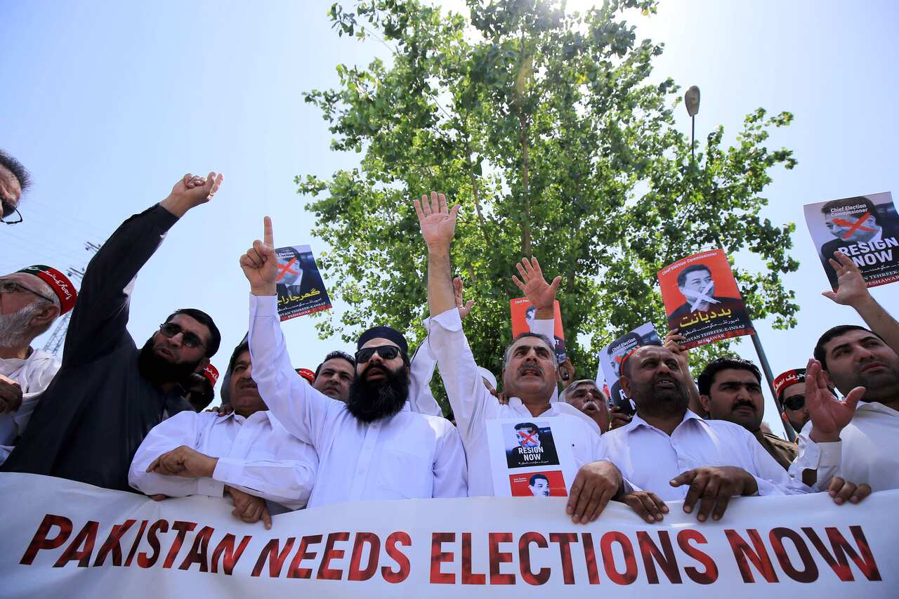 Supporters of political party Pakistan Tehrik-e-Insaf, shout slogans outside the election commission of pakistan (ECP) office.