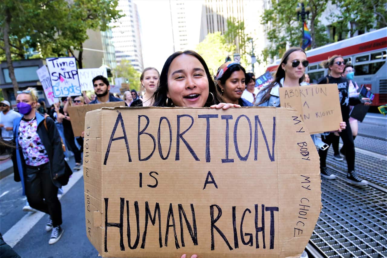A protester holds a placard reading " Abortion is a Human Right" during the demonstration. In San Francisco, hundreds of protesters took to the streets with placards, they want to uphold their abortion right and they think abortion or not should be decide