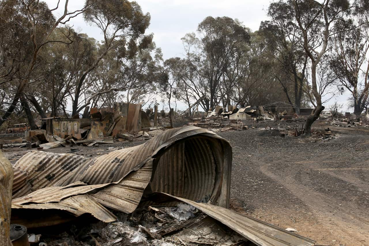 A destroyed home outside Woodside  in Adelaide, Sunday, December 22, 2019. The Cudlee Creek fire has burnt through 25,000 hectares within a 127 kilometre perimeter in the Adelaide Hills. (AAP Image/Kelly Barnes) NO ARCHIVING