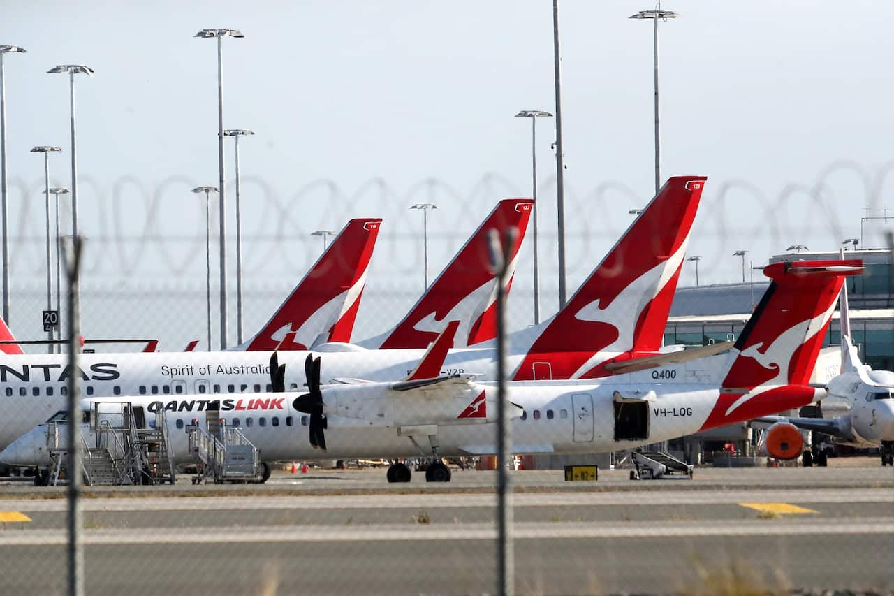 A general view of Qantas planes at Brisbane domestic airport. Monday, September 20, 2021. A traveller has tested positive for COVID-19 after potentially being infectious at Brisbane Airport for four hours.(AAP Image/Jono Searle) NO ARCHIVING