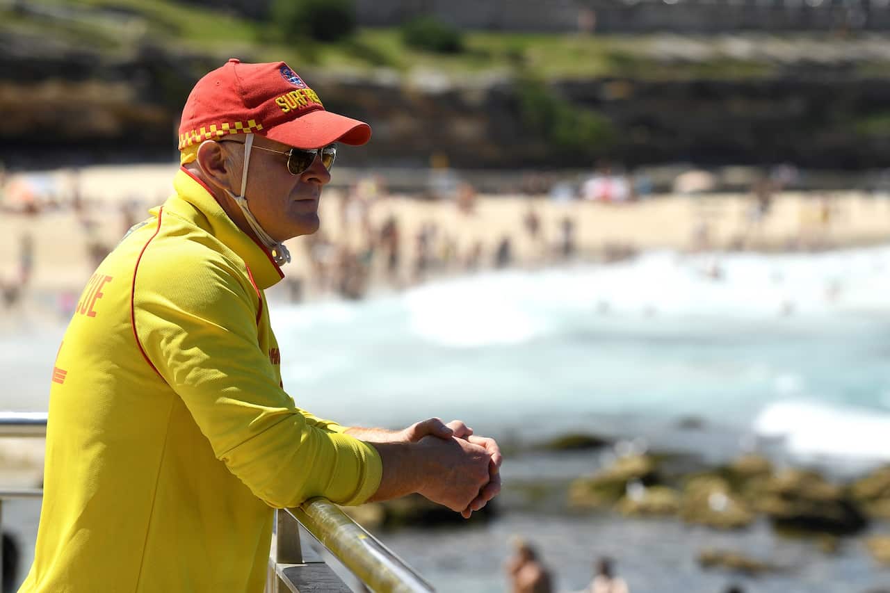 A Surf Rescue guard on patrol during heatwave conditions at Bronte Beach in Sydney, Saturday, November 28, 2020.