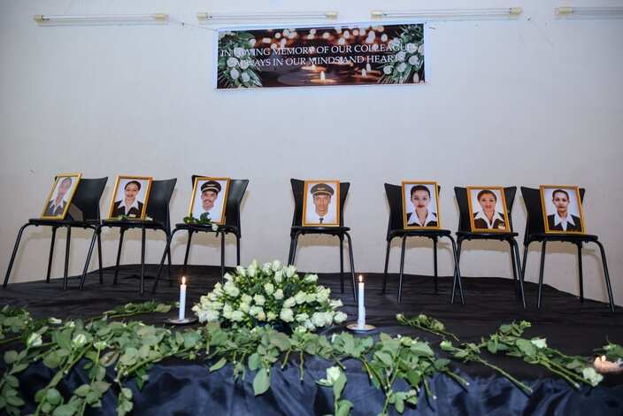 Photographs of the crew members of the Ethiopian Airlines flight ET 302 that crashed are displayed during a memorial service.