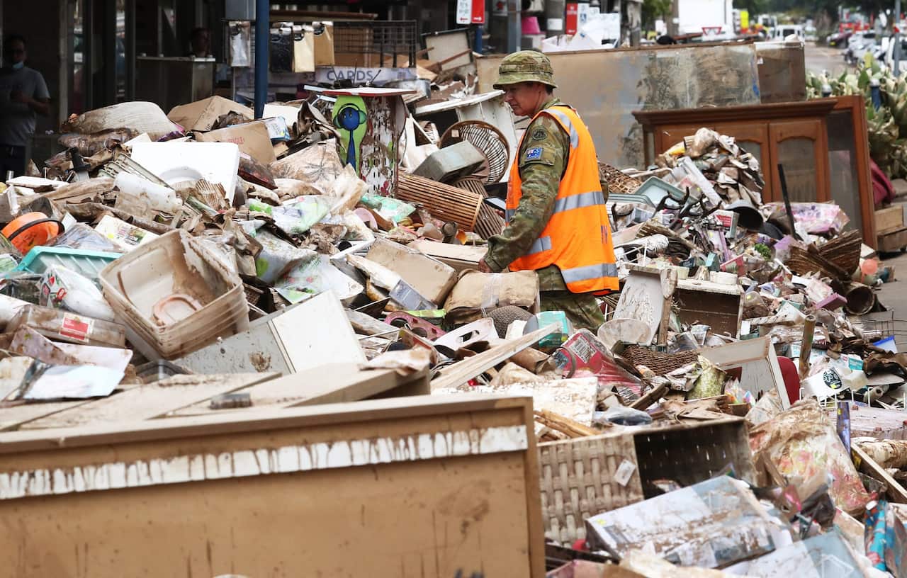 ADF personnel assist with the clean up after the floods in Lismore, NSW, 