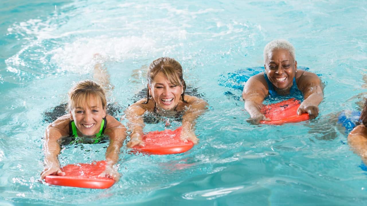 Adult swimming classes in women swimming pool - Getty Images - Kali9