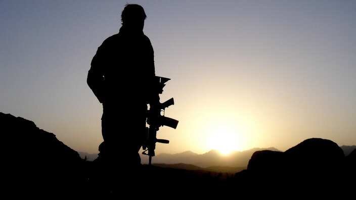 An Australian Special Operations Task Group soldier observing the valley during the Shah Wali Kot Offensive.