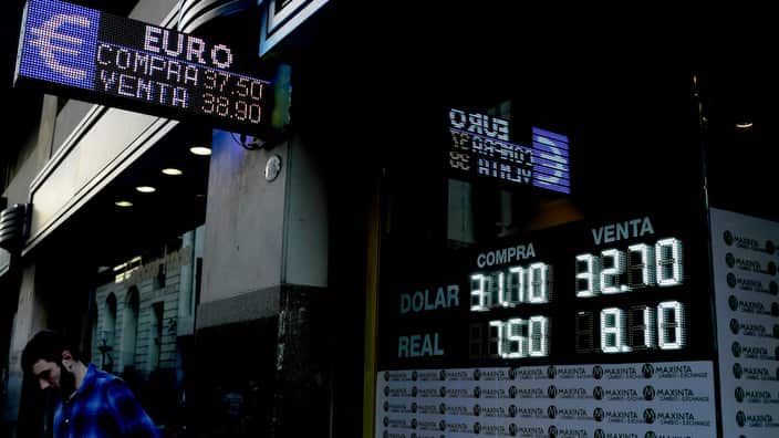 A man stands outside an exchange office in Buenos Aires, Argentina, Wednesday, Aug. 29, 2018.