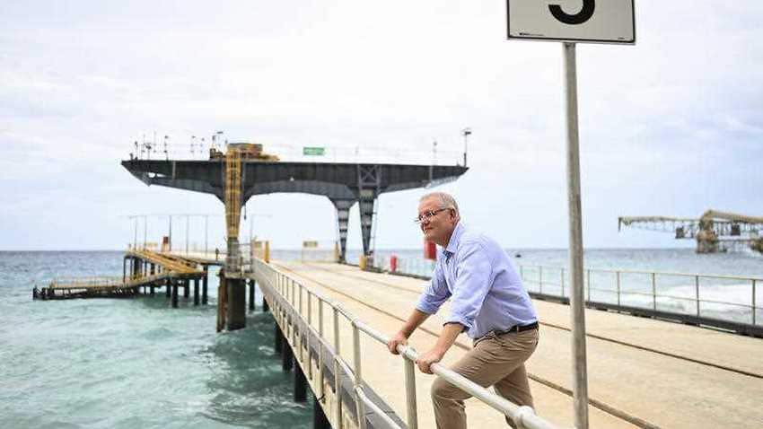 Australian Prime Minister Scott Morrison poses for photographs on the jetty at Christmas Island in March 2019 (AAP).