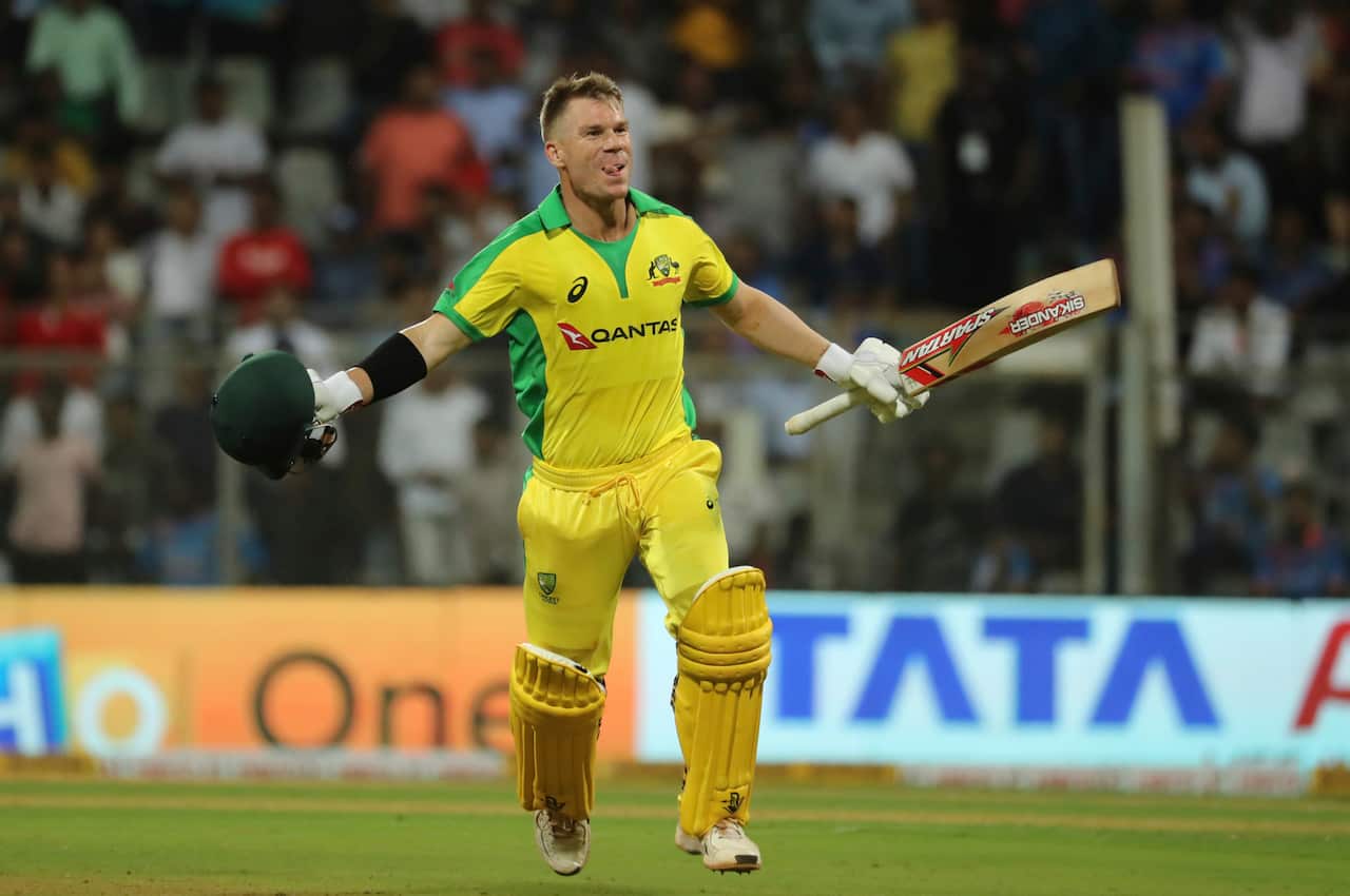 Australia's David Warner celebrates after scoring a hundred during the first one-day international cricket match between India and Australia in Mumbai, India, Tuesday, Jan. 14, 2020. (AP Photo/Rafiq Maqbool)