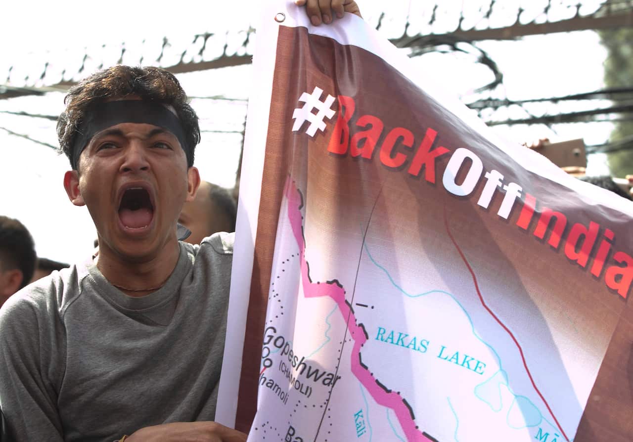 A Nepalese student shouts slogans during a protest near the Indian embassy in Kathmandu, Nepal, Friday, Nov. 8, 2019.