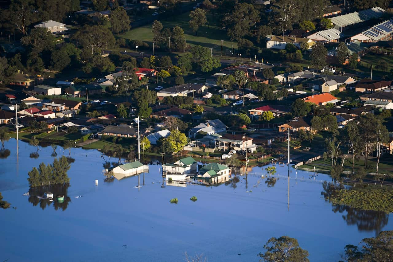 Buildings are partially submerged in a floodwater in the Windsor area, northwest of Sydney