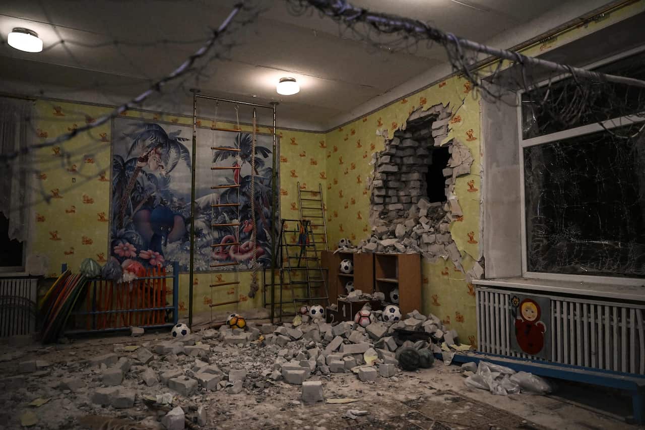 TOPSHOT - A photograph shows debris after the reported shelling of a kindergarden in the settlement of Stanytsia Luhanska, Ukraine, on February 17, 2022. - U.S. Defence Secretary Lloyd Austin warned on February 17, 2022, of a provocation by Moscow to just