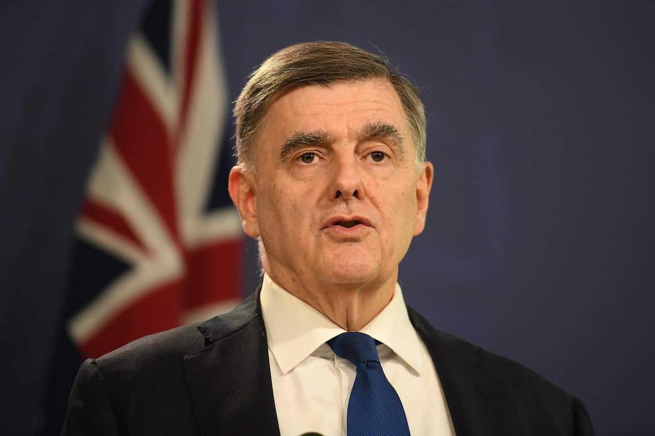 Dr. Brendan Murphy, Secretary of the Department of Health joins Prime Minister Scott Morrison during a press conference in Sydney, Friday, March 5, 2021