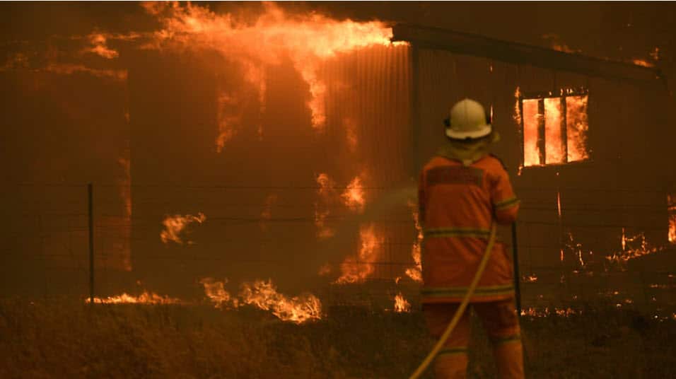 NSW Rural Fire Service crews fight the Gospers Mountain Fire as it impacts a property at Bilpin, Saturday, 21 December, 2019.