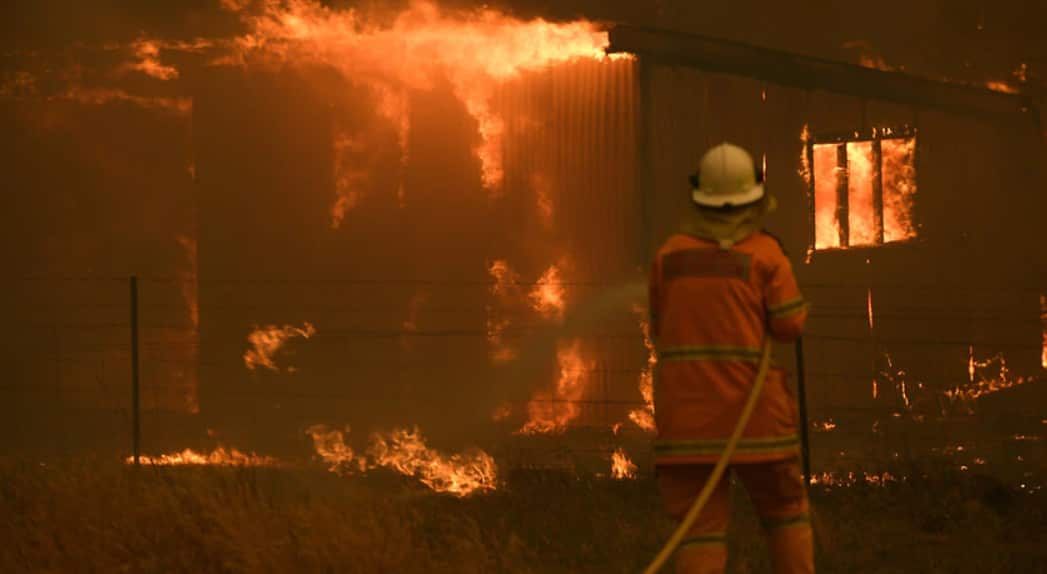 NSW Rural Fire Service crews fight the Gospers Mountain Fire as it impacts a property at Bilpin, Saturday, 21 December, 2019.