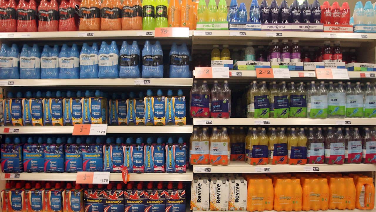General view of soft drinks on supermarket shelving 