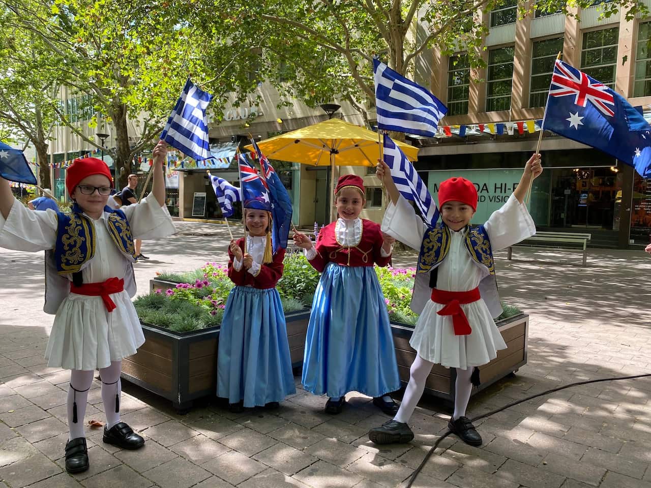 Children dressed in Greek uniforms