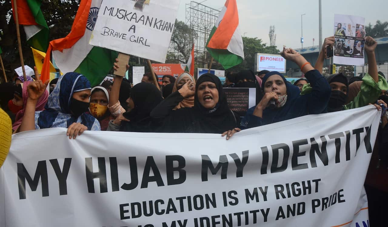 Muslim women stand for protest against Hijab for ban. Many women wearing hijab, amid a row over sporting the headscarf in Karnataka, India on Feb. 10, 2022.