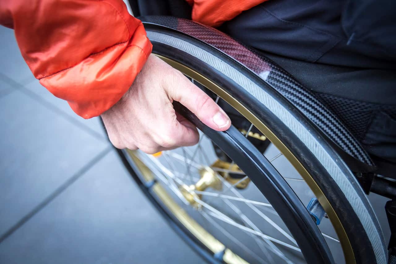 High Angle View Of Man Sitting On Wheelchair