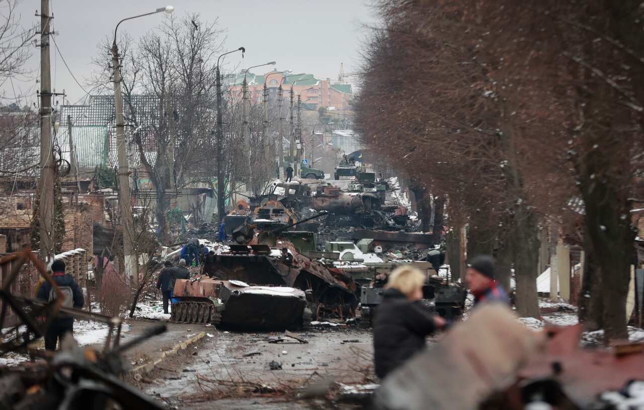 Russian military vehicles on a road in the town of Bucha, close to the capital Kyiv, Ukraine, 