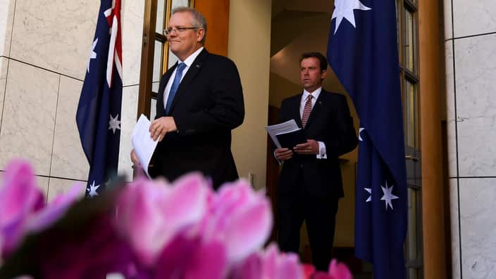 Australian Prime Minister Scott Morrison (left) and Australian Education Minister Dan Tehan arrive to speak to the media during a press conference at Parliament House in Canberra, Thursday, September 20, 2018.