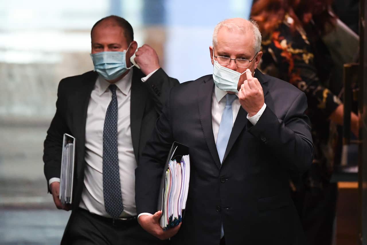 Australian Prime Minister Scott Morrison (right) and Australian Treasurer Josh Frydenberg arrive during House of Representatives Question Time at Parliament House in Canberra, Monday, August 24, 2020.