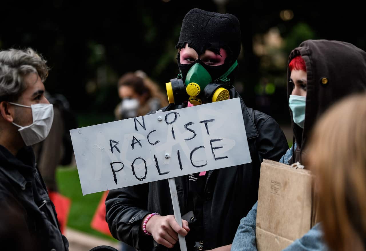 Protesters gather during a Black Lives Matter protest, following the death in Minneapolis police custody of George Floyd, in Sydney, Tuesday, June 2, 2020. (AAP Image/James Gourley) NO ARCHIVING