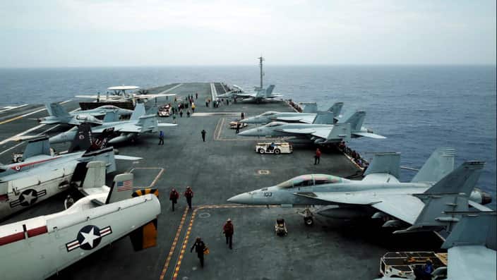 F/A-18 Hornet fighter jets and E-2D Hawkeye plane are seen on the U.S. aircraft carrier John C. Stennis during joint military exercise called Malabar.