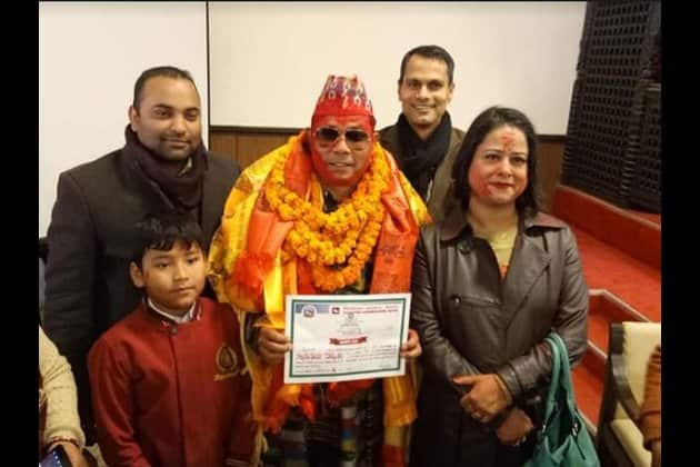 Resham Chaudhary (center) recently took an oath as a member of parliament.