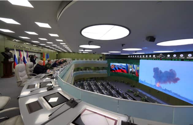 Officials watch the test launch of the Avangard intercontinental strategic missile with a gliding hypersonic warhead