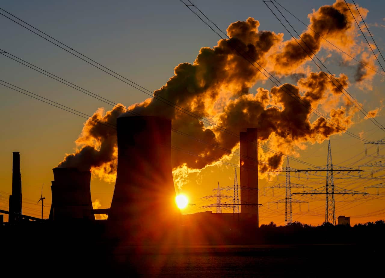 FILE - Steam comes out of the chimneys of the coal-fired power station in Niederaussem, Germany, Sunday, Oct. 24, 2021. (AP Photo/Michael Probst, File)