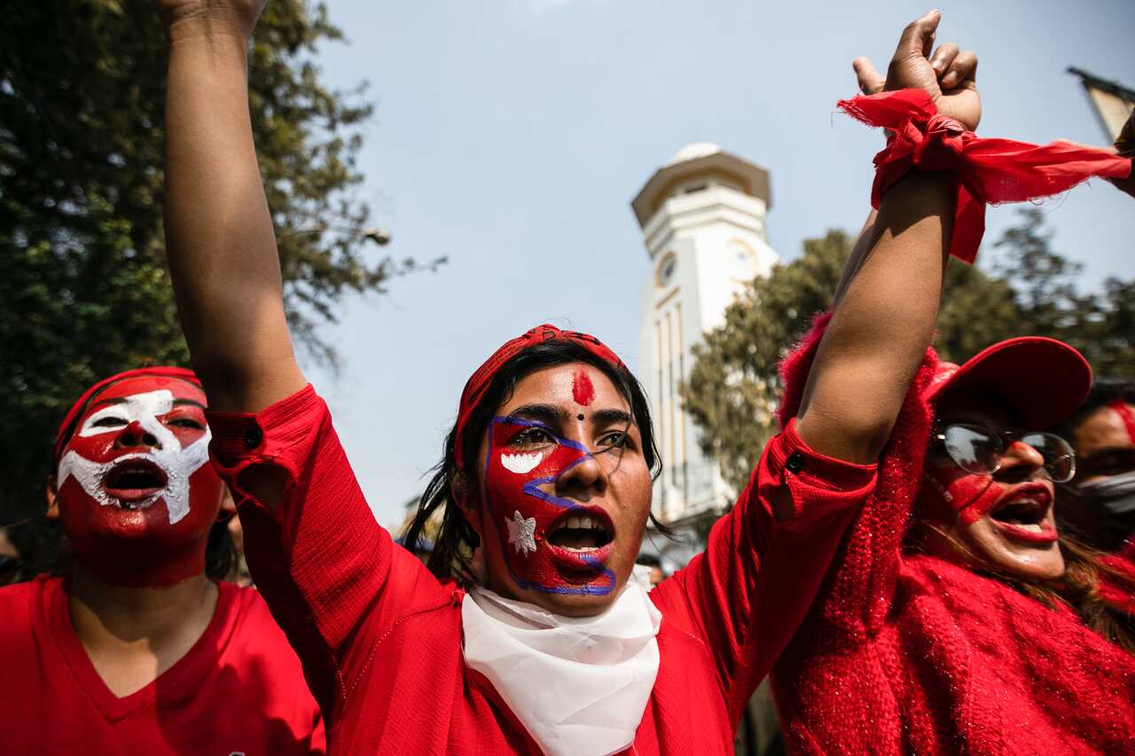 Supporters of the Nepal Communist Party attend a celebration rally one day after the Supreme Court ordered the reinstatement of Parliament after being dissolved by the prime minister