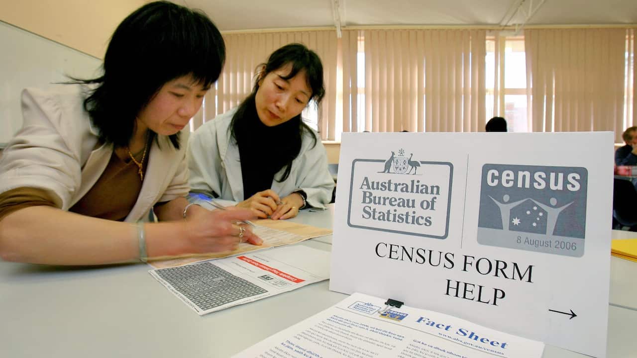 Teacher helps student filling her Census forms