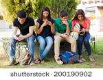 Teenagers using mobile phones at school-Pixabay