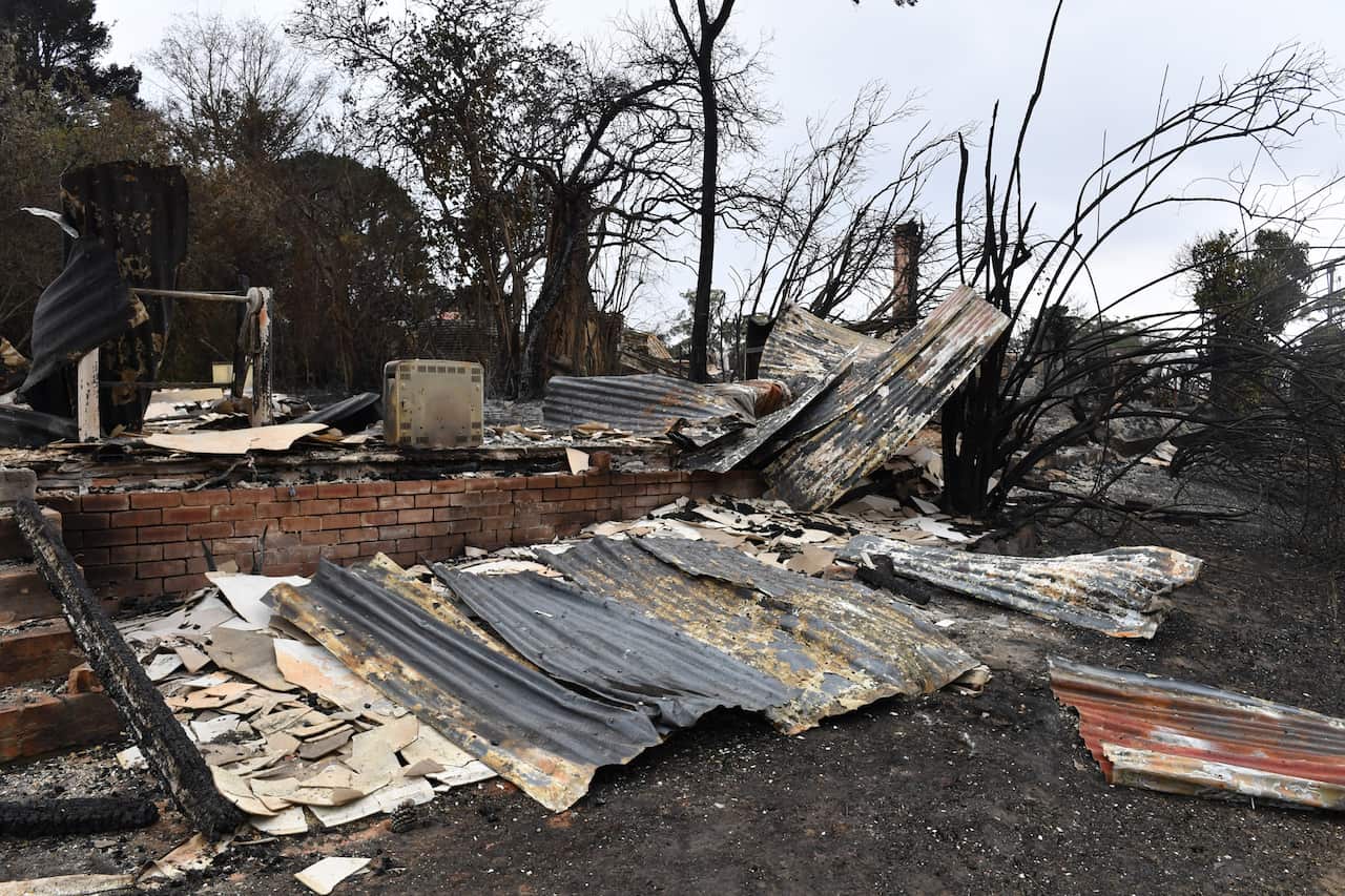 The burnt out remains of a house is seen from a bushfire in the Southern Highlands town of Wingello, 160km south west of Sydney, Monday, January 6, 2020. (AAP Image/Mick Tsikas) NO ARCHIVING