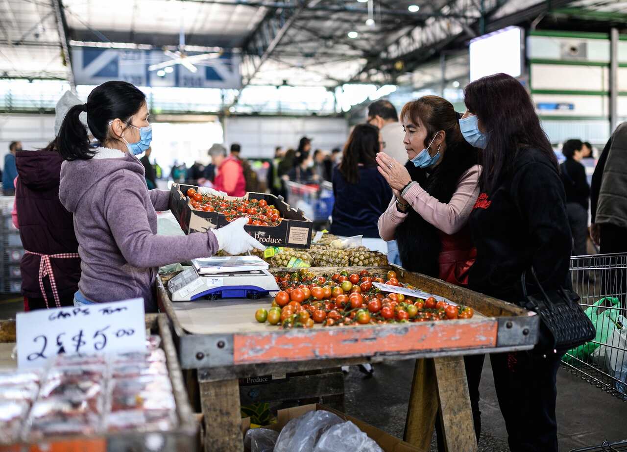 Market traders and shoppers at Paddy's Market
