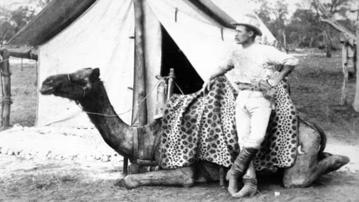 A police officer from Western Australia poses with his camel in photo dated only in the early 1900s in Alice Springs, Australia.