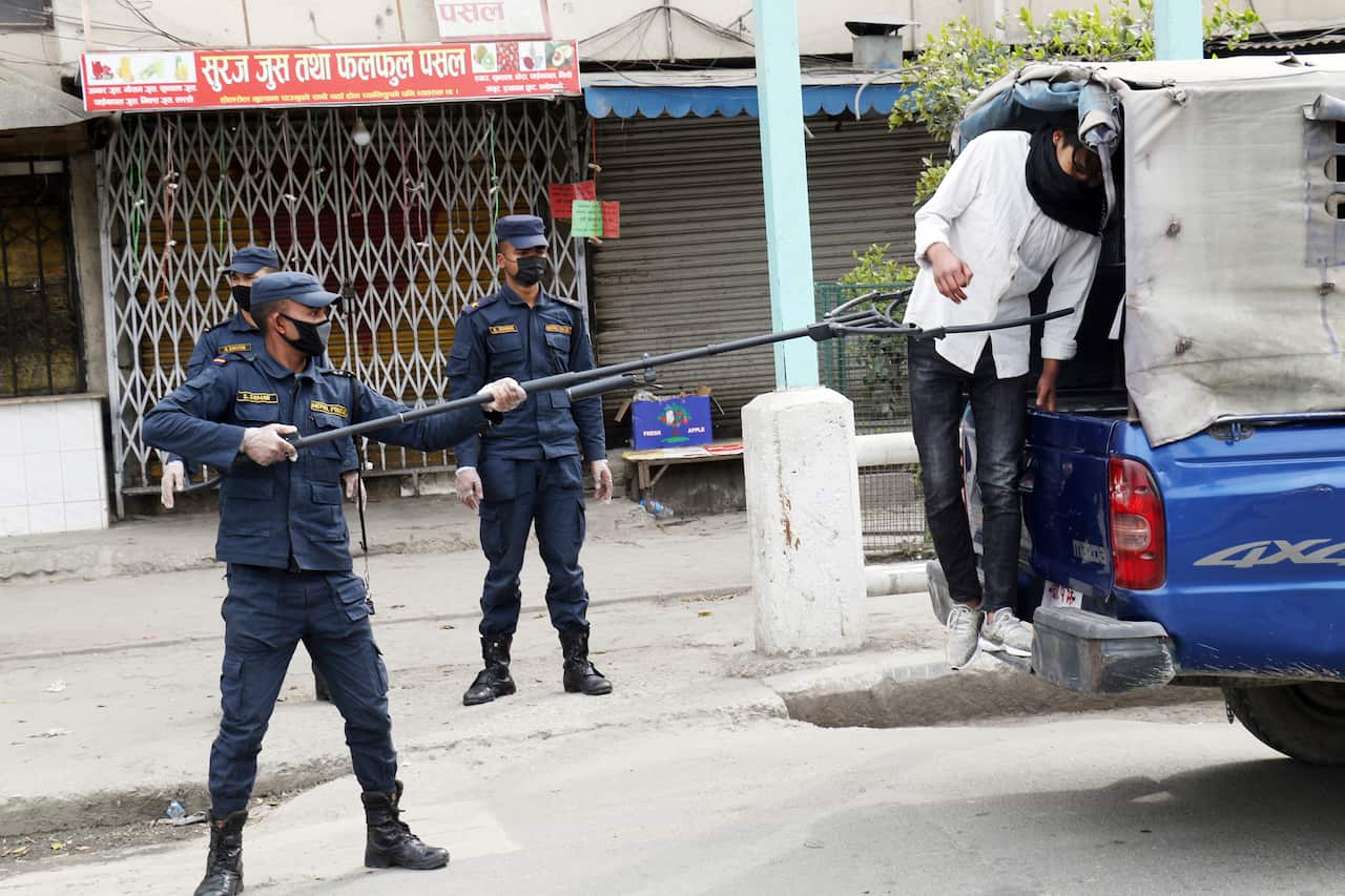 police arrests man in Nepal for ignoring lockdown, using multi function arrest and rescue device (2)