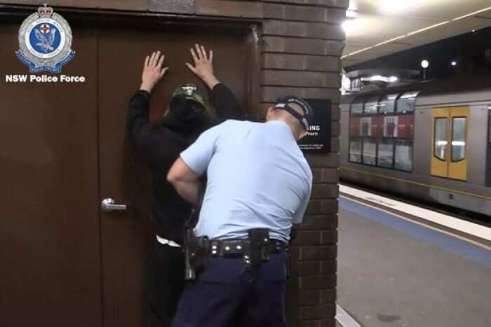 A police officer conducts a search.