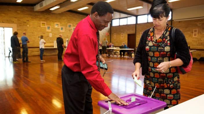 Voters posting their votes