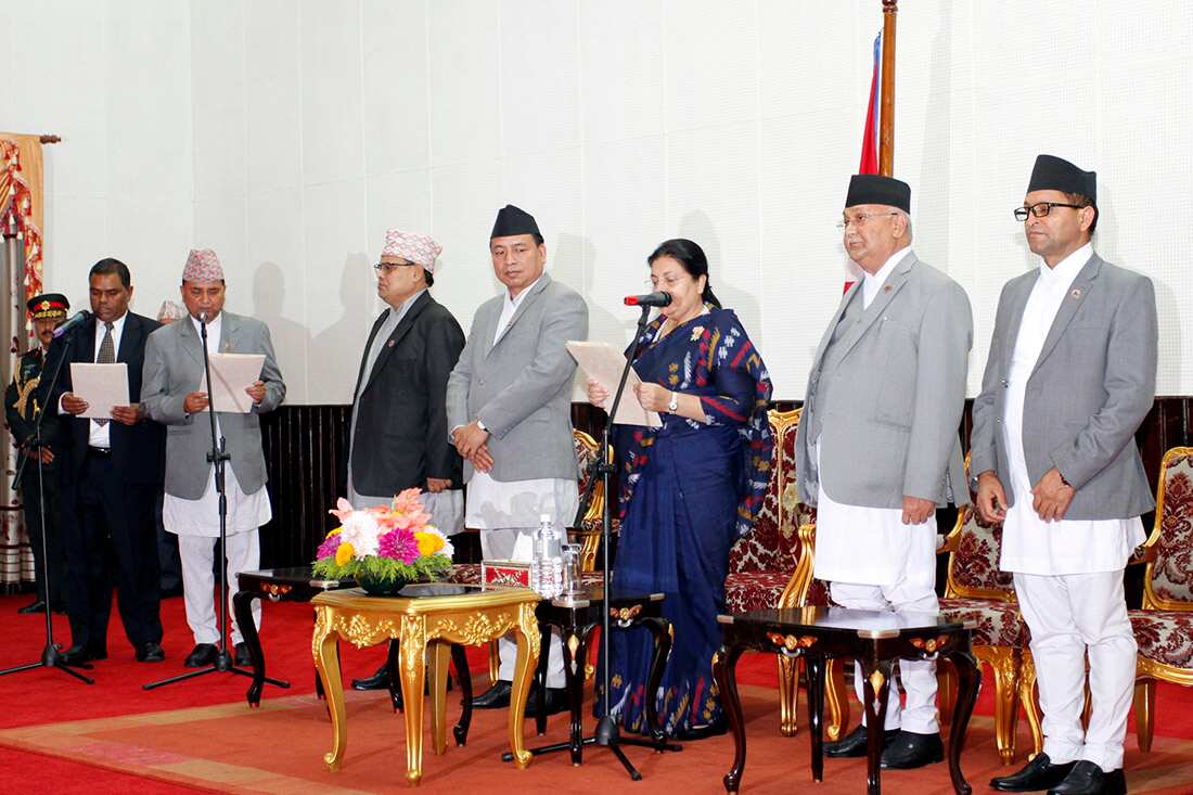 President Bidhya Devi Bhandari swearing in two new deputy prime ministers in Ishwar Pokharel and Uprendra Yadav.